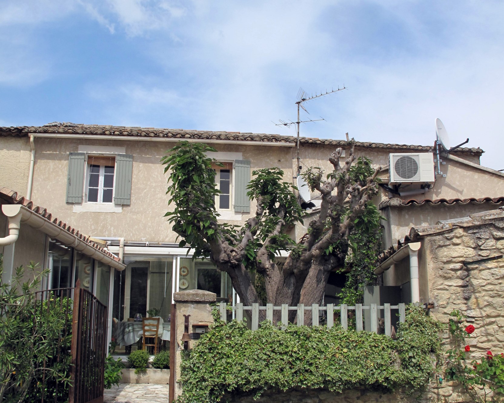 In Gordes, for sale, old hamlet renovated stone house with private courtyard, garden and garage 