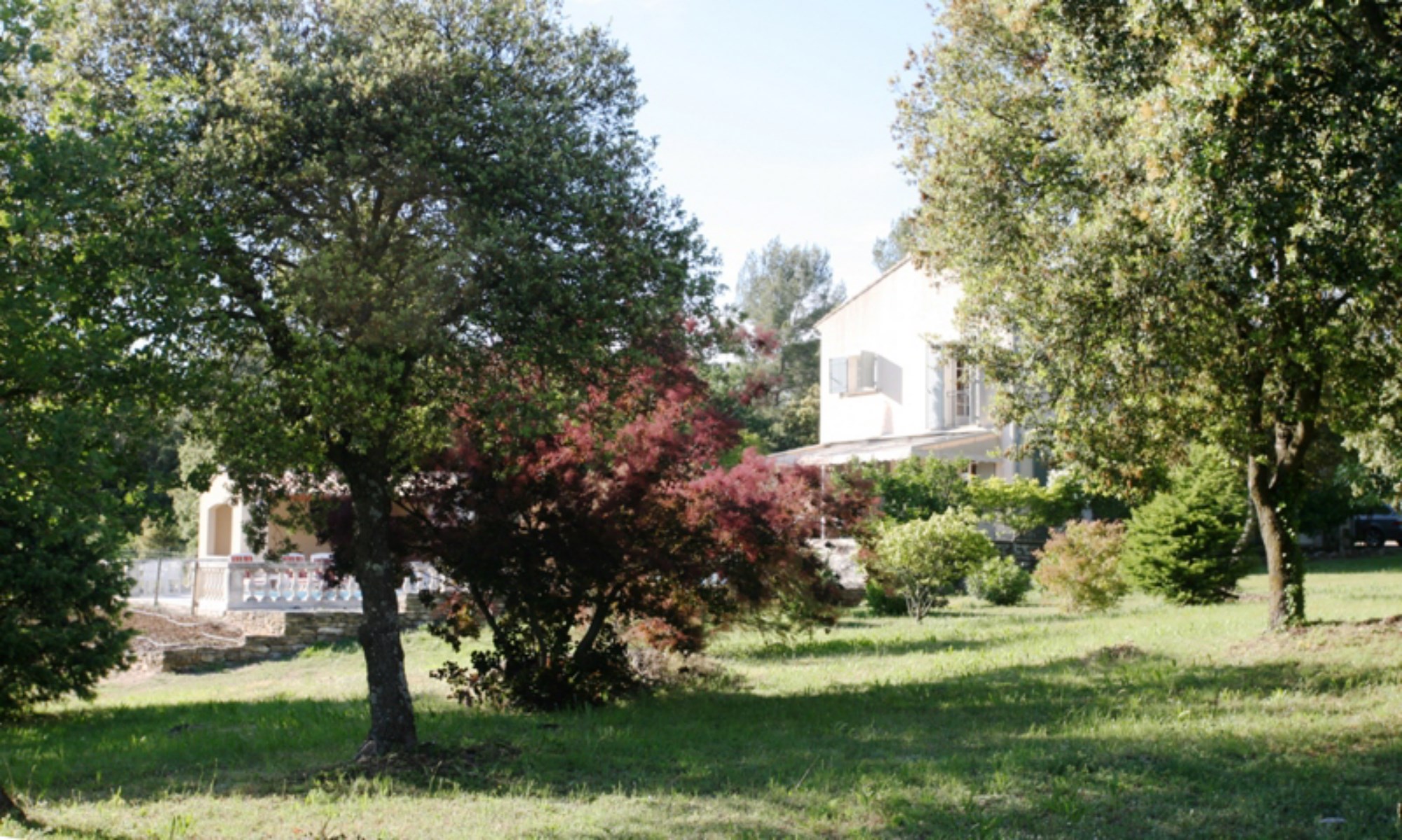 For sale, provencal property with pool and terrace overlooking a vineyard, countryside and facing the Luberon