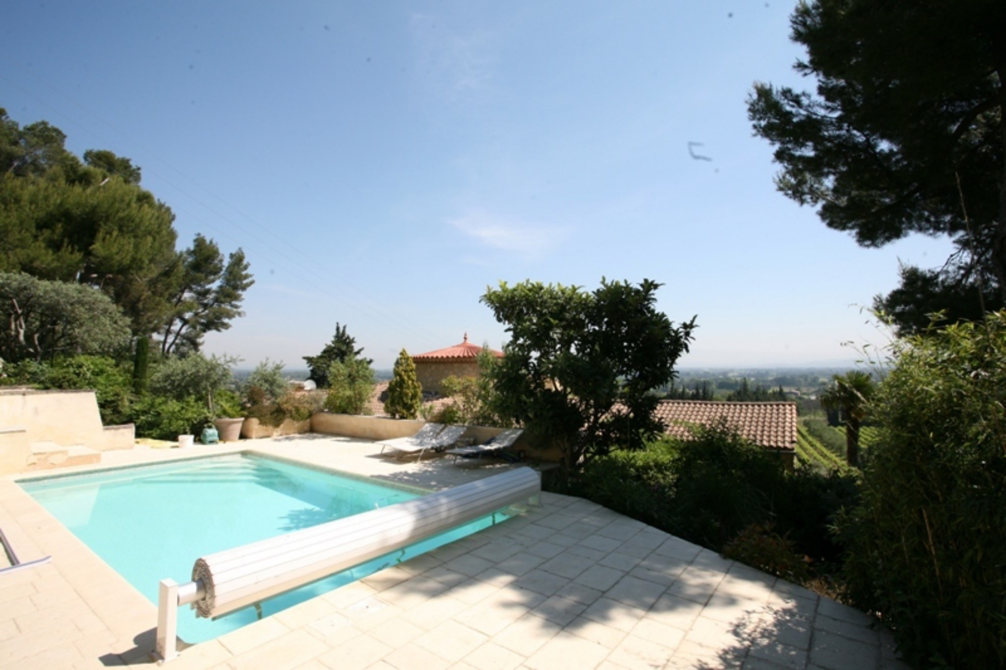 Comtat Venaissin, near Avignon, for sale, nice stone house, built on a high position overlooking the valley with garden and swimming pool