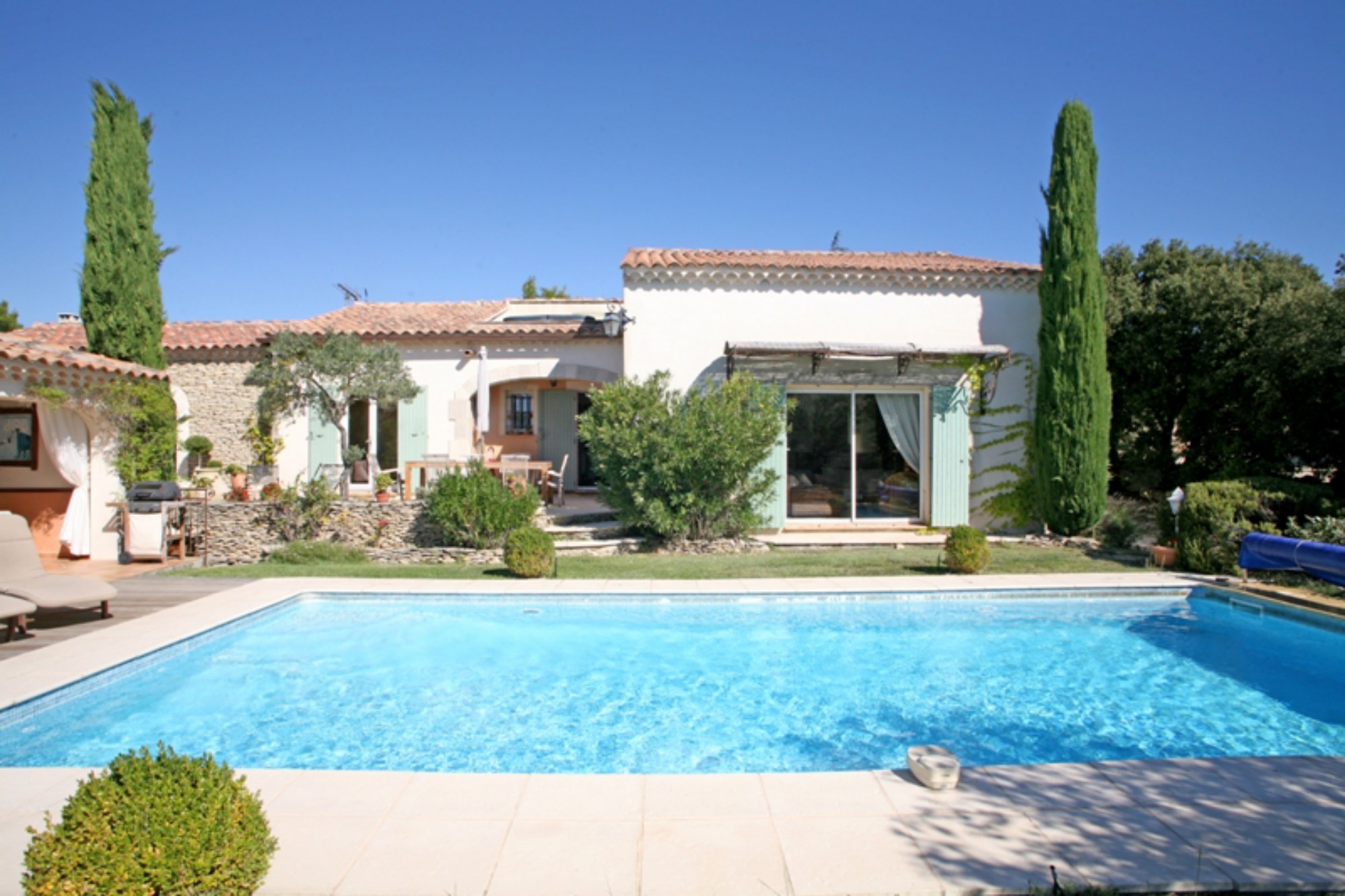 Near Gordes in Luberon, for sale, lovely house with terrace, garden, swimming pool, facing the Luberon offering stunning views