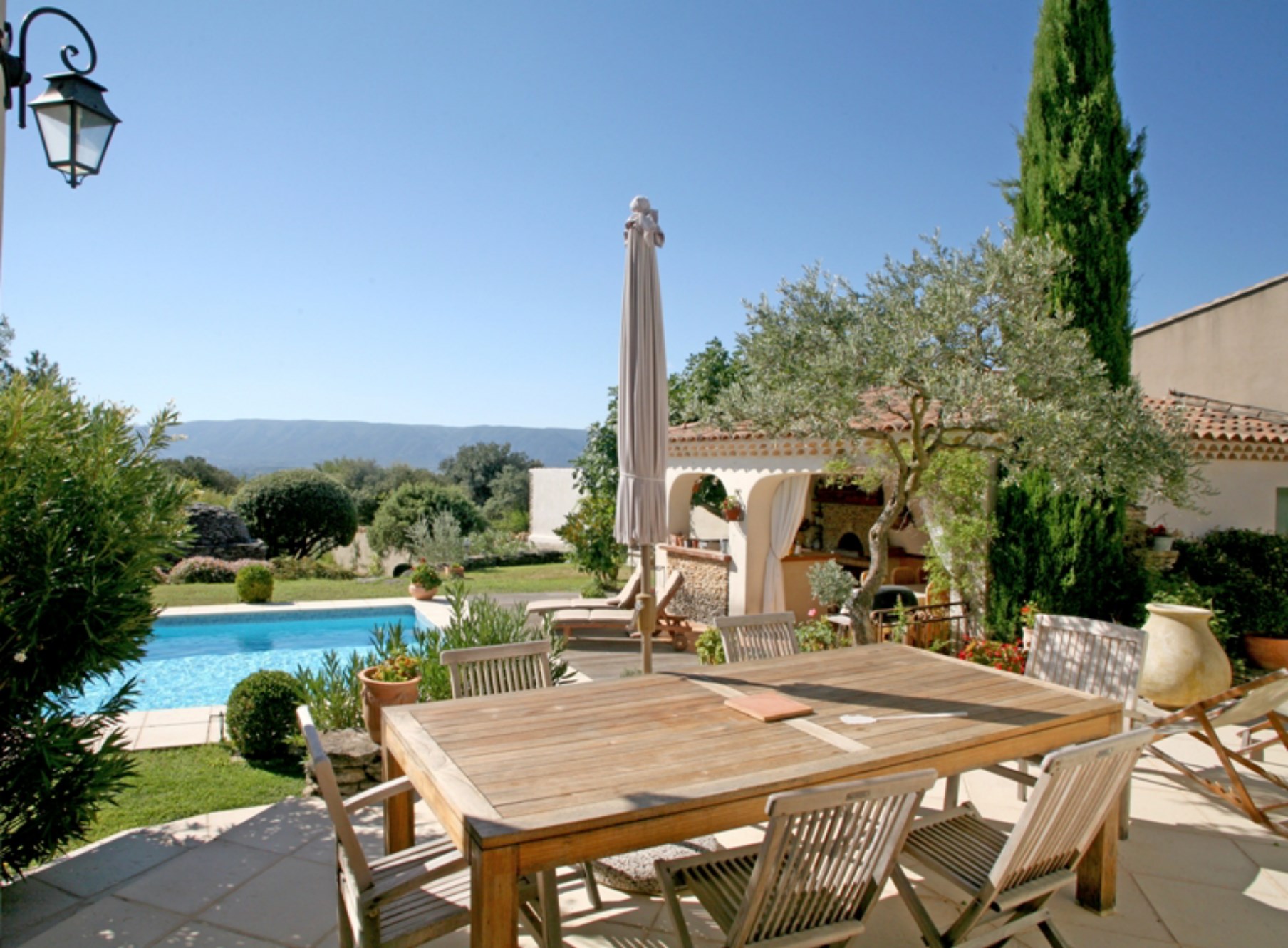 Near Gordes in Luberon, for sale, lovely house with terrace, garden, swimming pool, facing the Luberon offering stunning views
