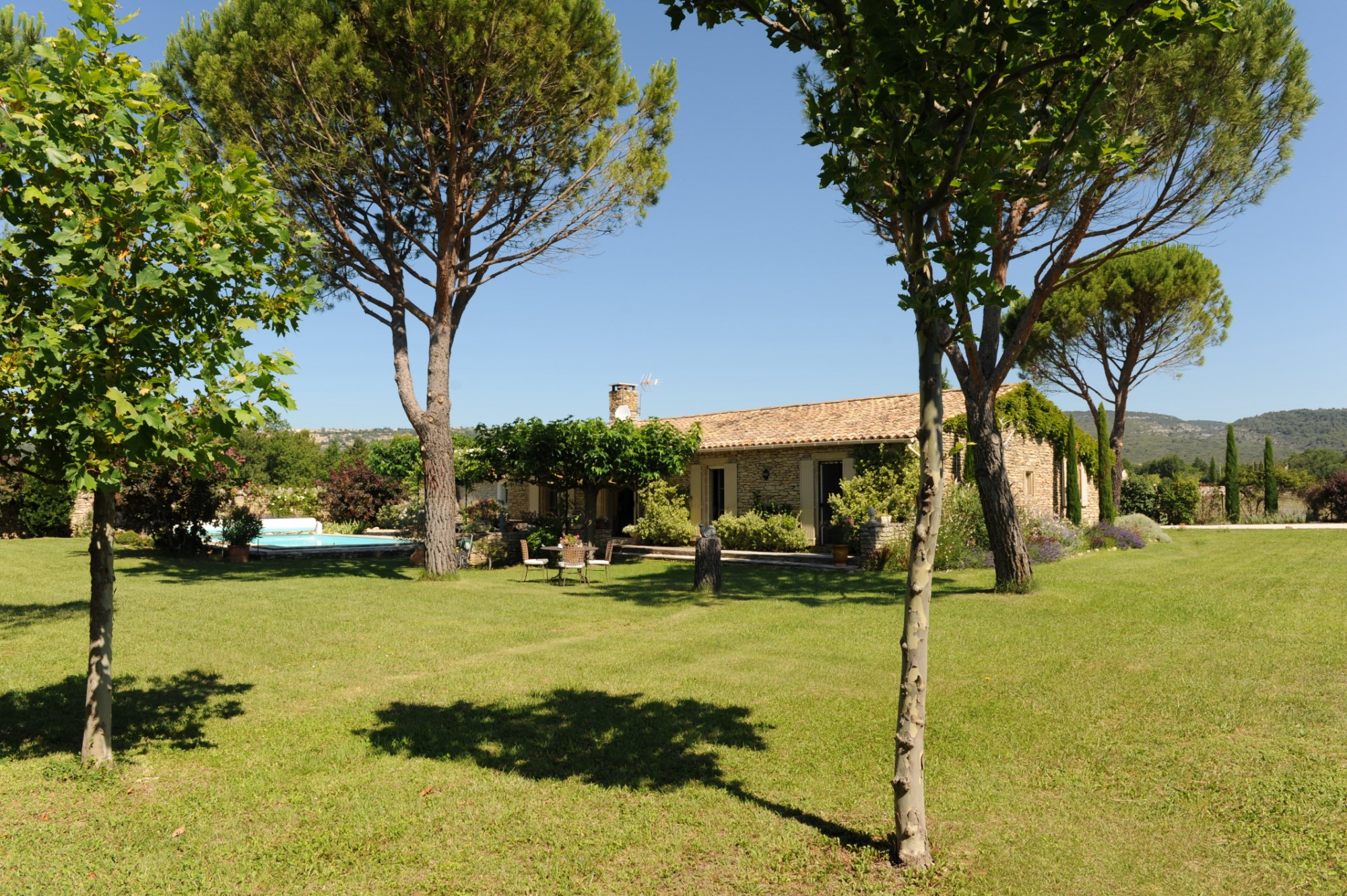 For sale, in Gordes, one storey stone house with large garden and swimming pool