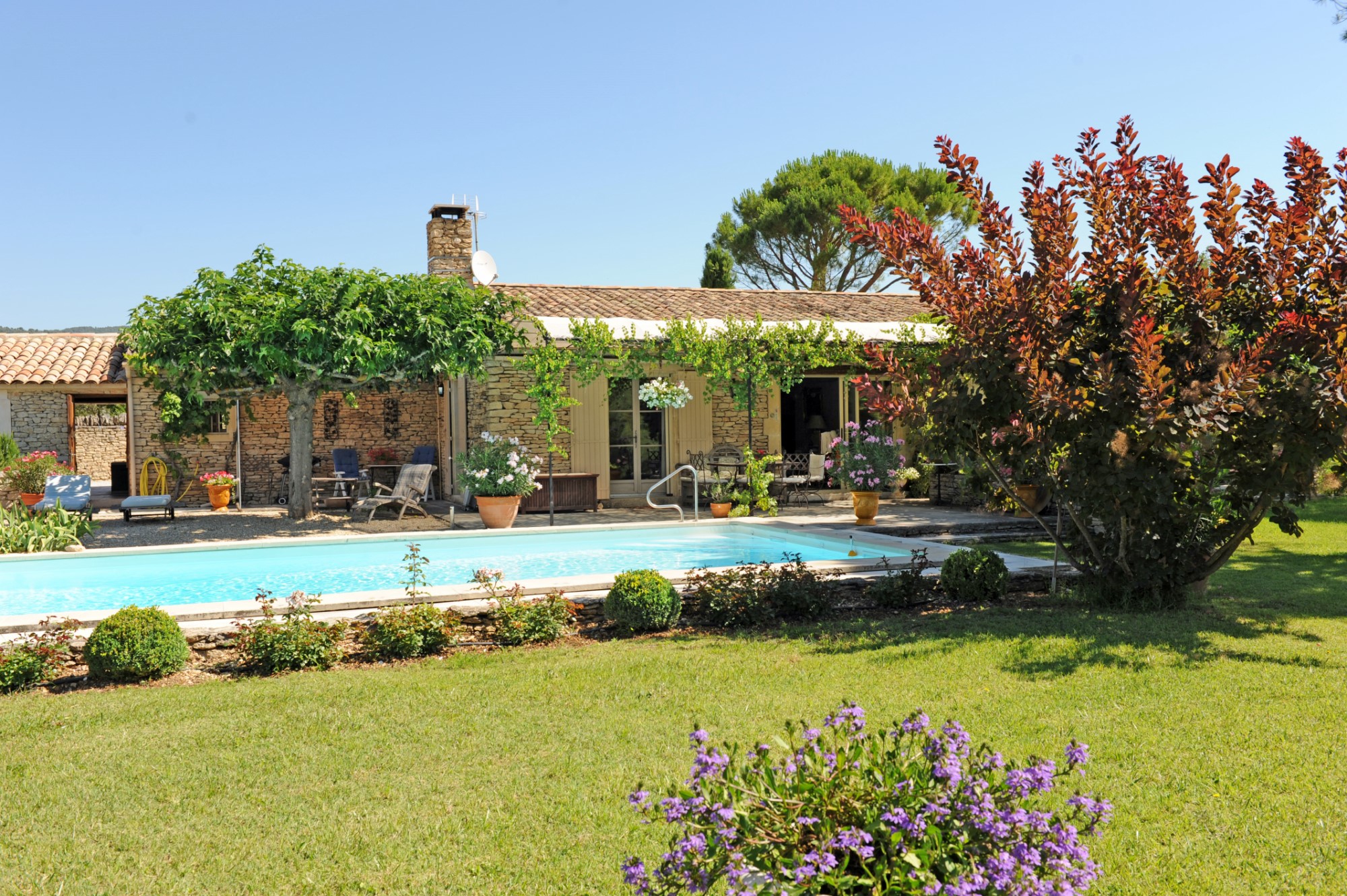 For sale, in Gordes, one storey stone house with large garden and swimming pool