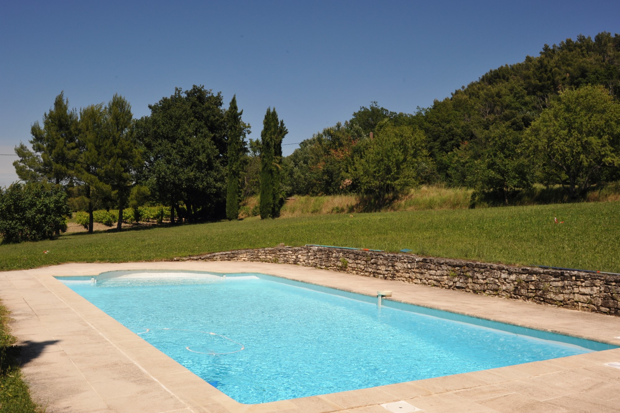 In the heart of the Luberon regional park, for sale, an authentic renovated farmhouse with swimming pool for sale, on more than 1.7 hectares of land with stunning views on a hilltop village