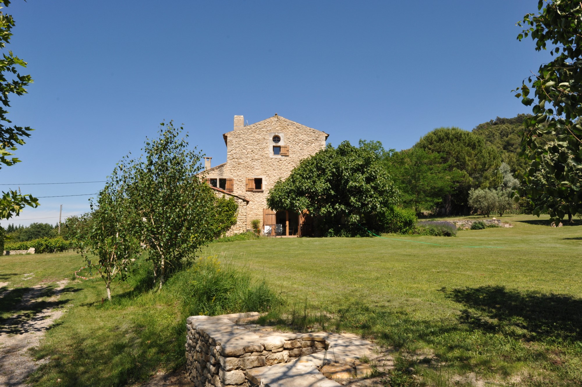 In the heart of the Luberon regional park, for sale, an authentic renovated farmhouse with swimming pool for sale, on more than 1.7 hectares of land with stunning views on a hilltop village