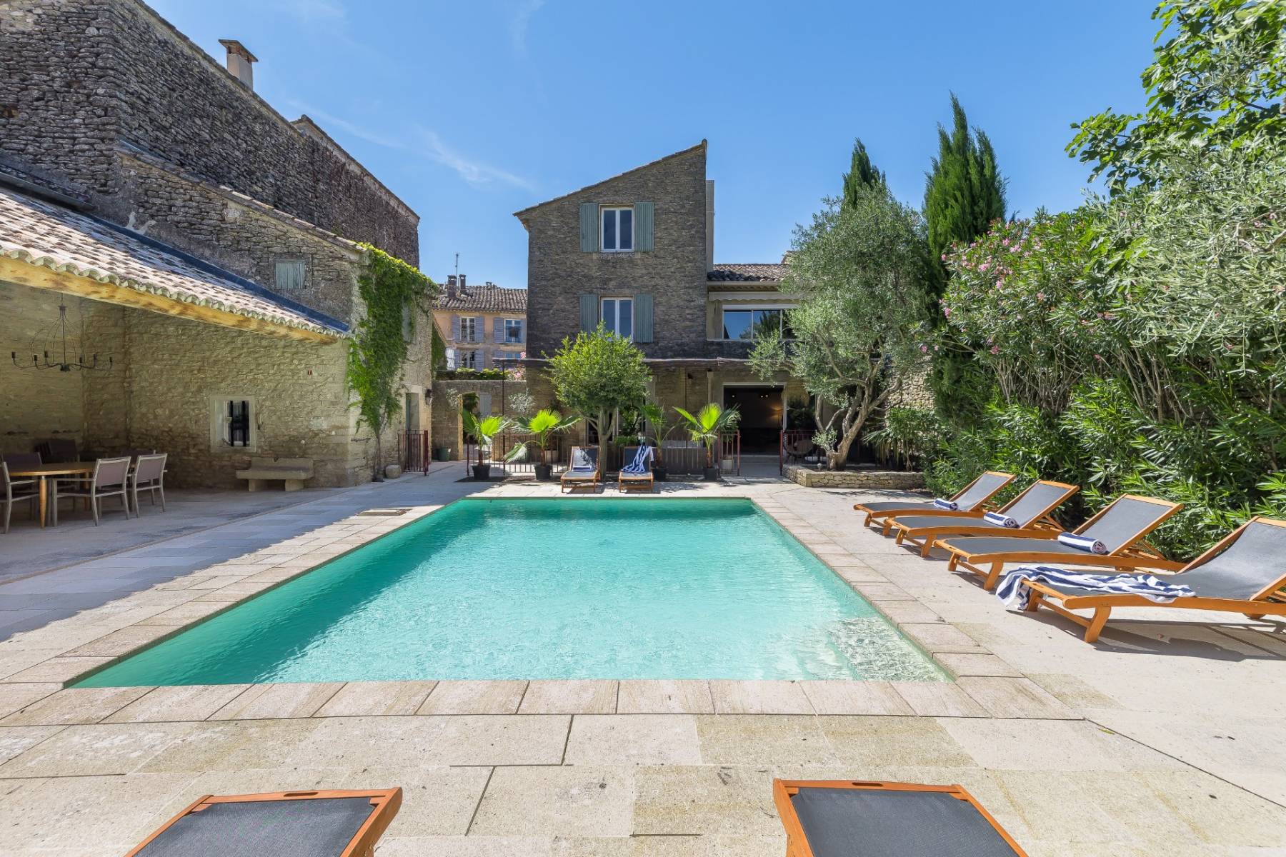 Authentic renovated House in a Gordes hamlet with pool, landscaped garden and expansive pool-house with outdoor summer kitchen